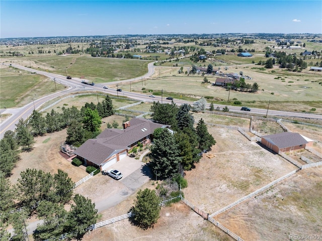 birds eye view of property featuring a rural view