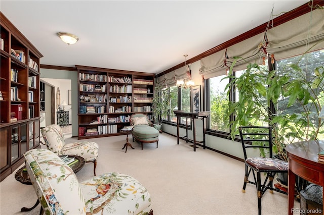 living area with carpet, crown molding, and a chandelier