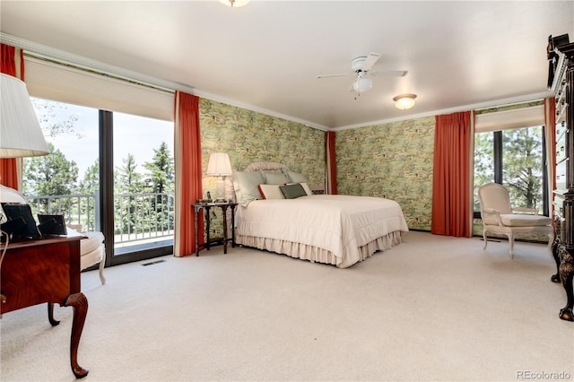 carpeted bedroom featuring access to outside and ceiling fan