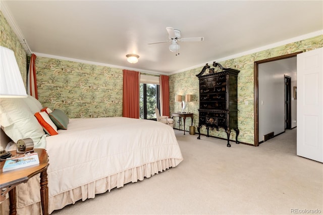 bedroom with carpet floors, crown molding, and ceiling fan