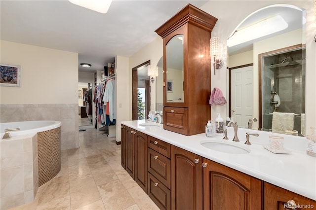 bathroom with separate shower and tub, tile patterned floors, and double sink vanity