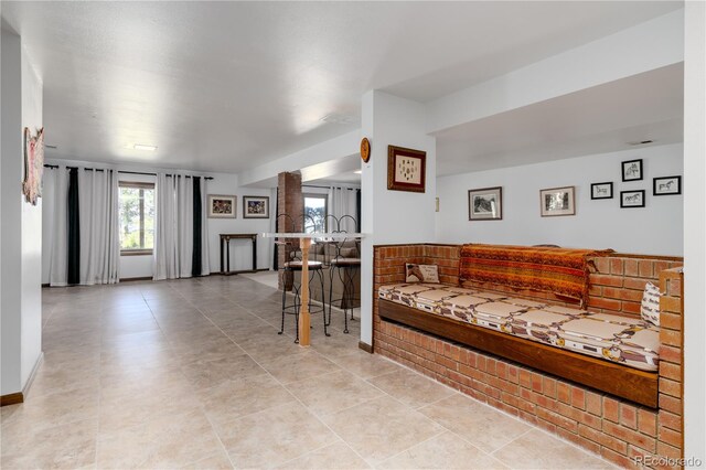 living room with light tile patterned floors