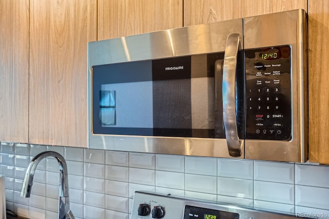 room details featuring decorative backsplash and light brown cabinets