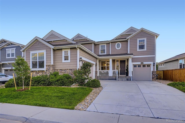 6063 Eldora St, Golden, CO 80403 - craftsman inspired home with stone siding, covered porch, a garage, and concrete driveway