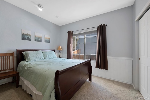 carpeted bedroom featuring a closet