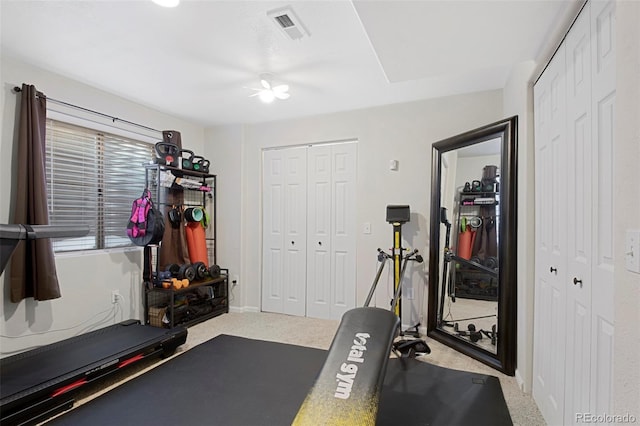 workout area with carpet and ceiling fan