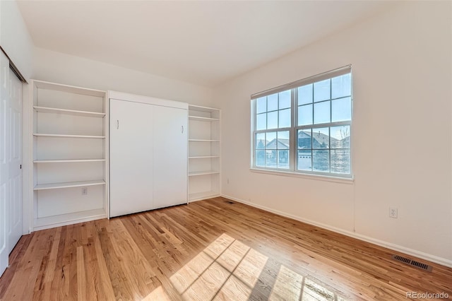 unfurnished bedroom featuring light hardwood / wood-style floors