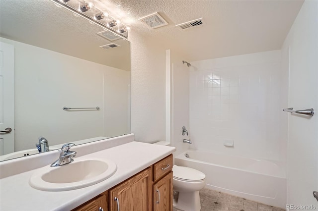 full bathroom with vanity,  shower combination, a textured ceiling, and toilet