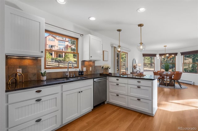 4185 Red Rock Dr, Larkspur, CO 80118 - kitchen featuring dishwasher, a sink, a peninsula, light wood finished floors, and recessed lighting
