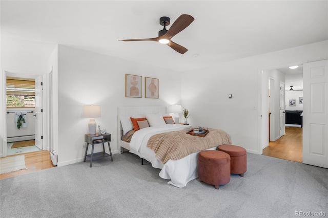 4185 Red Rock Dr, Larkspur, CO 80118 - carpeted bedroom with baseboards, a baseboard heating unit, a baseboard radiator, and ensuite bath