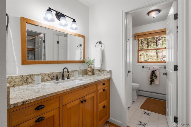 4185 Red Rock Dr, Larkspur, CO 80118 - bathroom featuring a baseboard heating unit, vanity, toilet, and baseboards