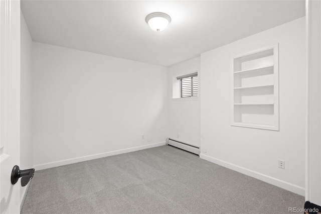 4185 Red Rock Dr, Larkspur, CO 80118 - carpeted spare room with baseboard heating, baseboards, and built in features