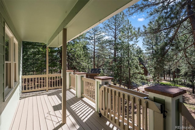 4185 Red Rock Dr, Larkspur, CO 80118 - wooden deck featuring view of wooded area