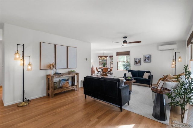 4185 Red Rock Dr, Larkspur, CO 80118 - living area with ceiling fan, light wood finished floors, and an AC wall unit