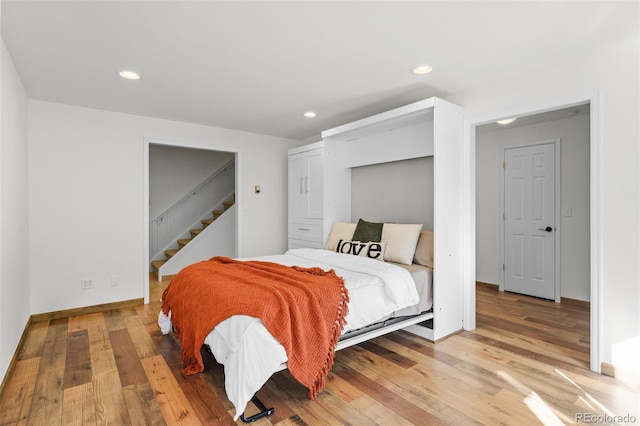 4185 Red Rock Dr, Larkspur, CO 80118 - bedroom featuring light wood finished floors, recessed lighting, and baseboards