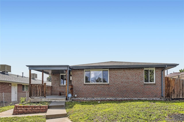 925 Wolff St, Denver, CO 80204 - view of front of home with brick siding and a porch