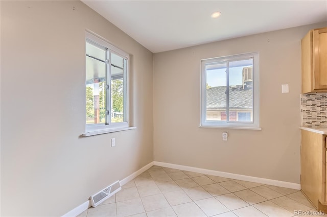 925 Wolff St, Denver, CO 80204 - unfurnished dining area with plenty of natural light, light tile patterned floors, and recessed lighting
