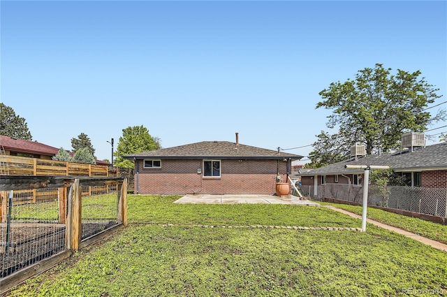 925 Wolff St, Denver, CO 80204 - rear view of property featuring a patio area, brick siding, and a fenced backyard