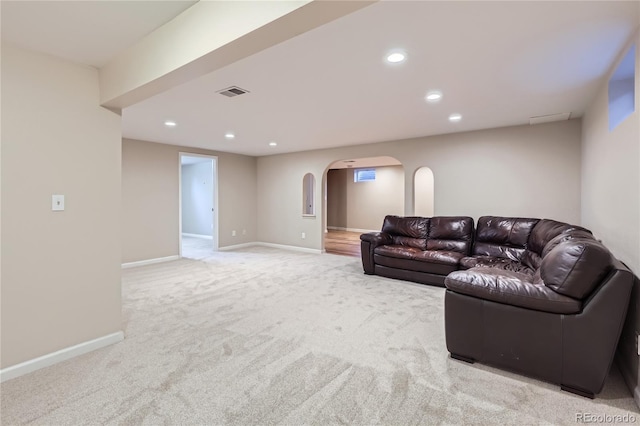 925 Wolff St, Denver, CO 80204 - carpeted living area featuring arched walkways and recessed lighting
