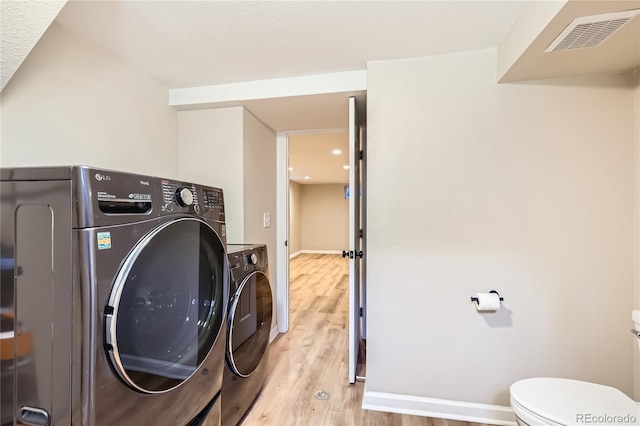 925 Wolff St, Denver, CO 80204 - laundry area with light wood finished floors and baseboards