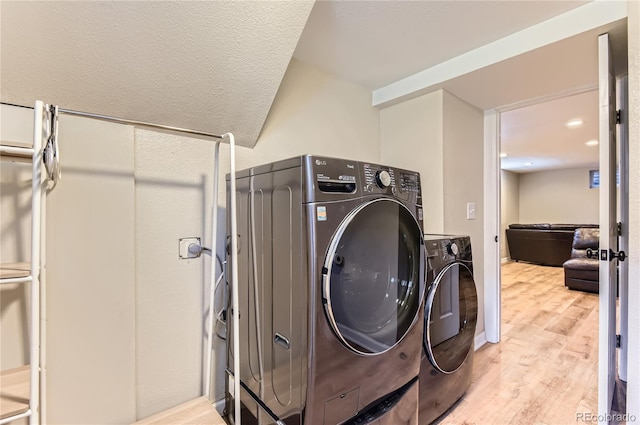 925 Wolff St, Denver, CO 80204 - washroom with washing machine and clothes dryer and light wood-type flooring