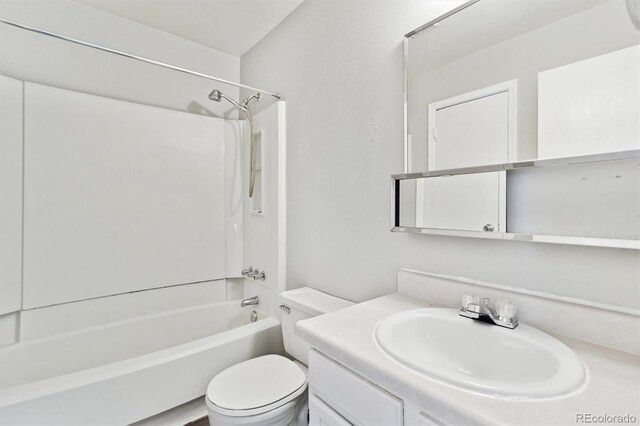 bathroom featuring bathtub / shower combination, toilet, and vanity