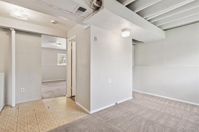 below grade area with carpet floors and baseboards