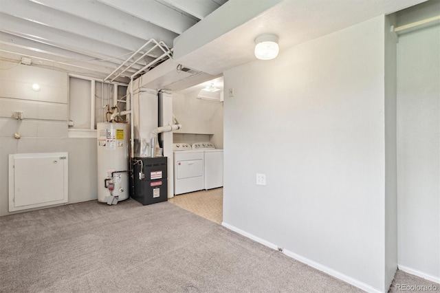 finished basement featuring gas water heater, washing machine and clothes dryer, carpet floors, and baseboards