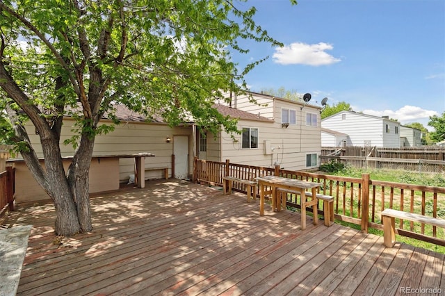wooden deck featuring fence