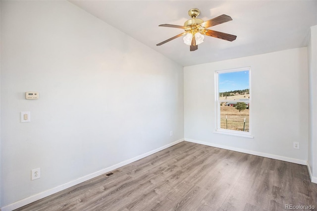 spare room with ceiling fan and light hardwood / wood-style floors