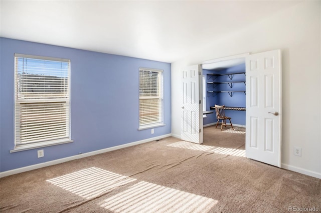 unfurnished bedroom with carpet flooring