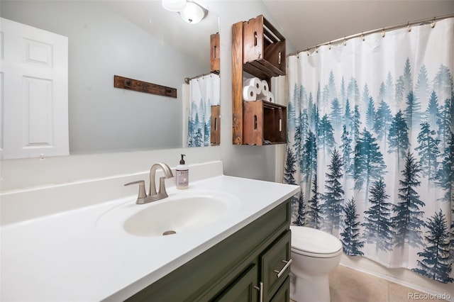 bathroom featuring tile patterned flooring, vanity, toilet, and walk in shower