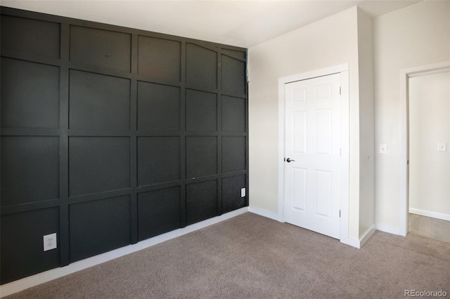 unfurnished bedroom with light colored carpet