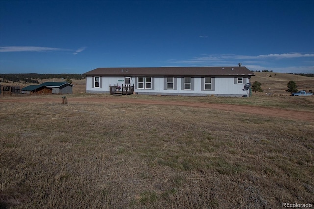 ranch-style home with a front lawn