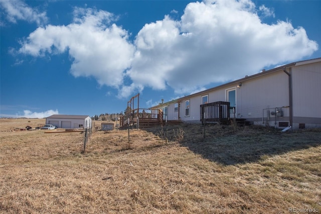 view of yard with a wooden deck