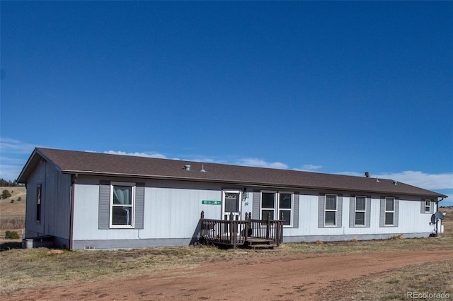 view of front of home featuring a wooden deck