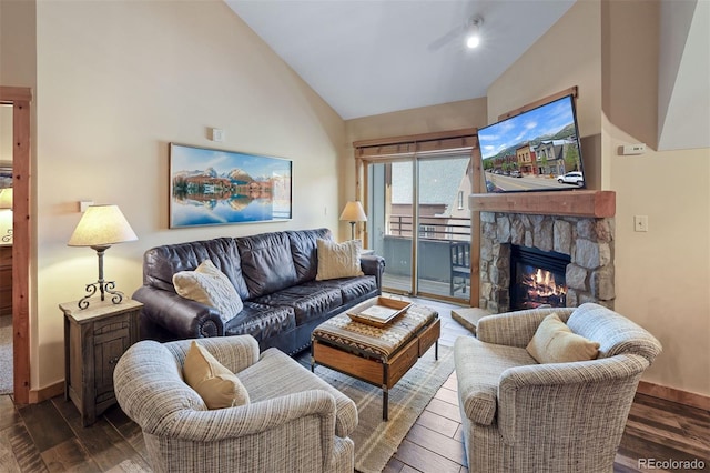 living room with high vaulted ceiling, dark hardwood / wood-style floors, and a fireplace