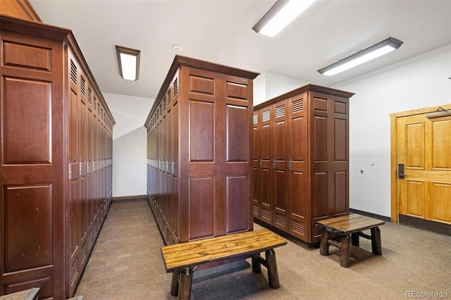 mudroom featuring light colored carpet