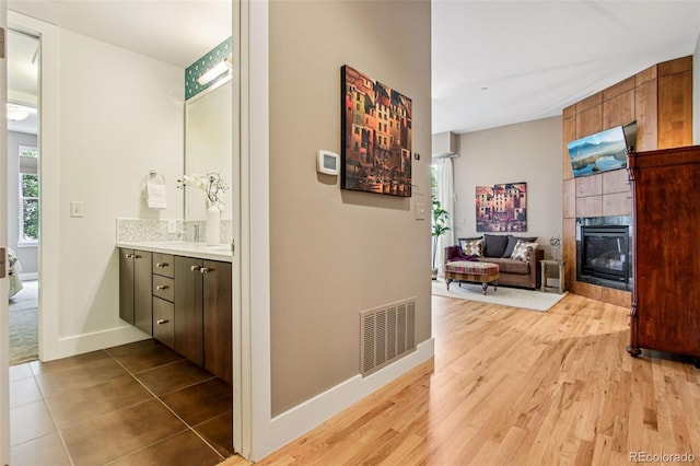 340 S Lafayette St Unit 204, Denver, CO 80209 - hallway with baseboards and wood finished floors