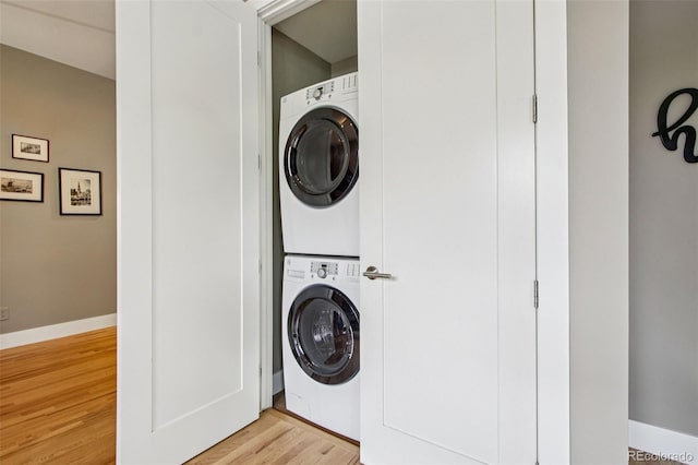 340 S Lafayette St Unit 204, Denver, CO 80209 - laundry room featuring stacked washing machine and dryer and light wood-style floors