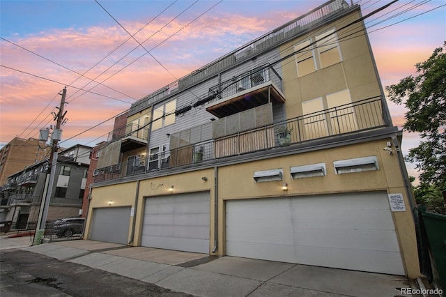340 S Lafayette St Unit 204, Denver, CO 80209 - view of building exterior featuring a garage