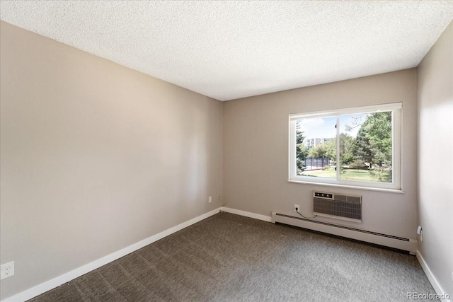 13902 E Marina Dr Unit 202, Aurora, CO 80014 - empty room with baseboard heating, dark colored carpet, a wall mounted AC, and a textured ceiling