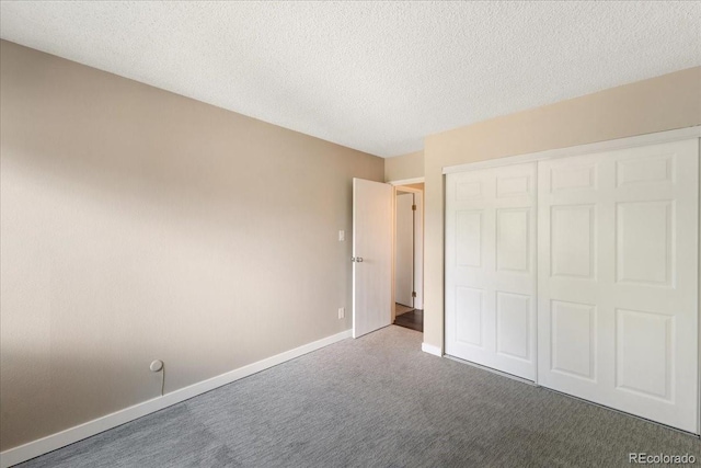13902 E Marina Dr Unit 202, Aurora, CO 80014 - unfurnished bedroom featuring carpet floors, a closet, and a textured ceiling