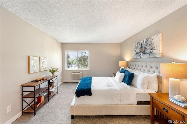 13902 E Marina Dr Unit 202, Aurora, CO 80014 - bedroom featuring a textured ceiling, carpet, a baseboard heating unit, and a wall unit AC