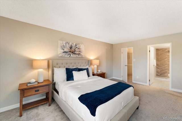 13902 E Marina Dr Unit 202, Aurora, CO 80014 - carpeted bedroom featuring a textured ceiling and ensuite bathroom