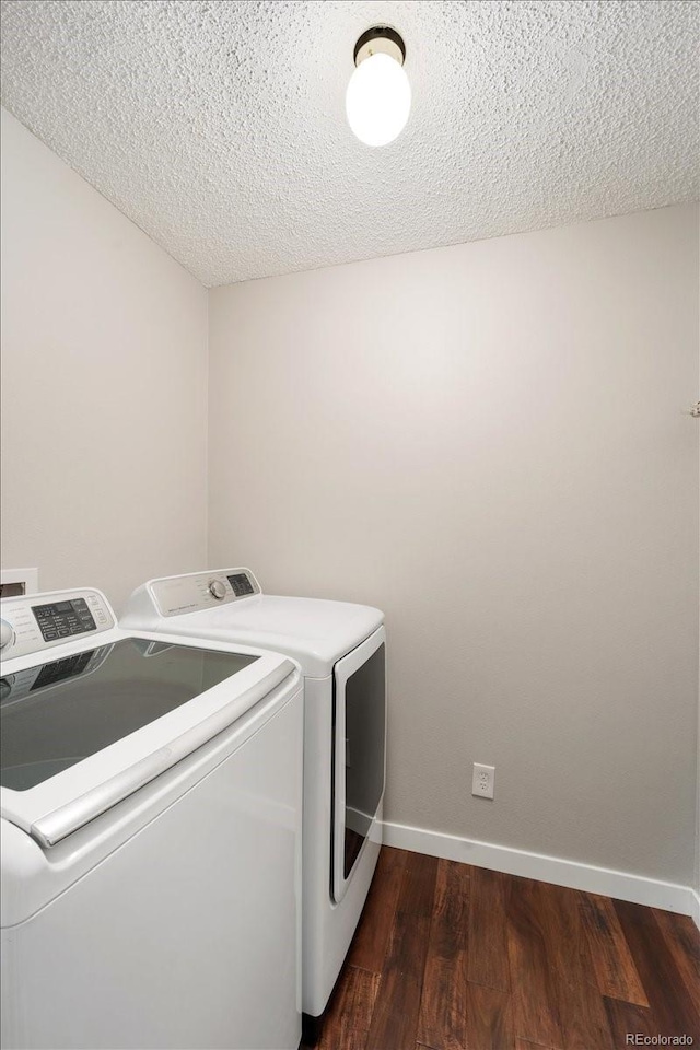13902 E Marina Dr Unit 202, Aurora, CO 80014 - laundry room featuring washing machine and dryer, dark wood-style floors, and a textured ceiling