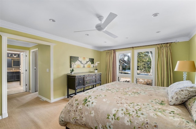 carpeted bedroom featuring ceiling fan and ornamental molding