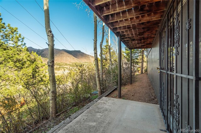 9610 Mohawk Trl, Cascade, CO 80809 - view of patio / terrace featuring a mountain view