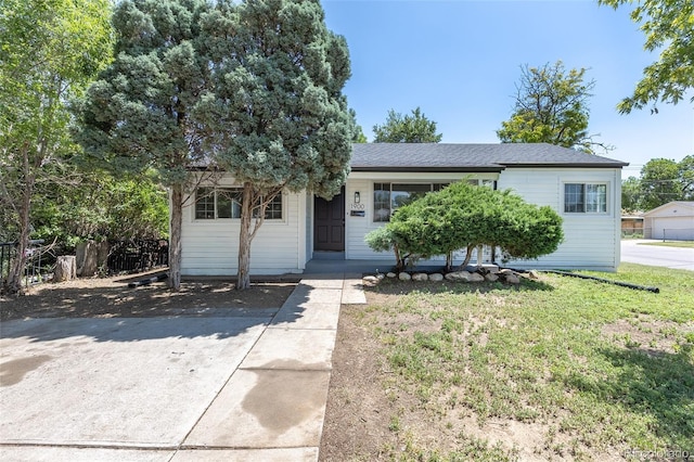 1900 Kingston St, Aurora, CO 80010 - view of front of house with a front lawn