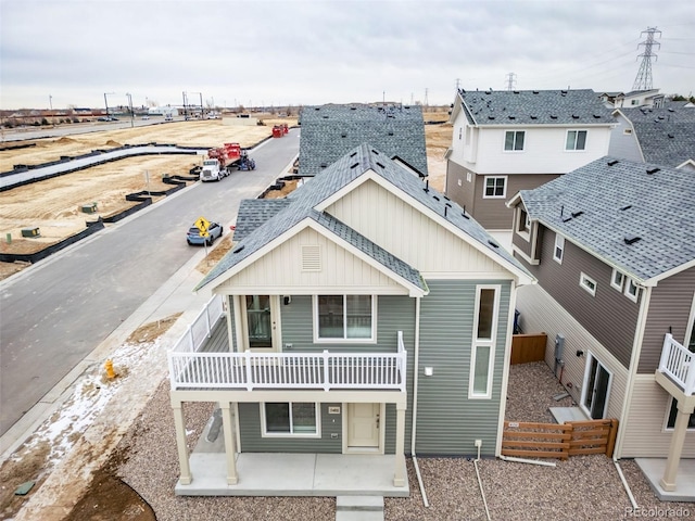 46546 Avery Ln, Bennett, CO 80102 - rear view of house with board and batten siding and a patio